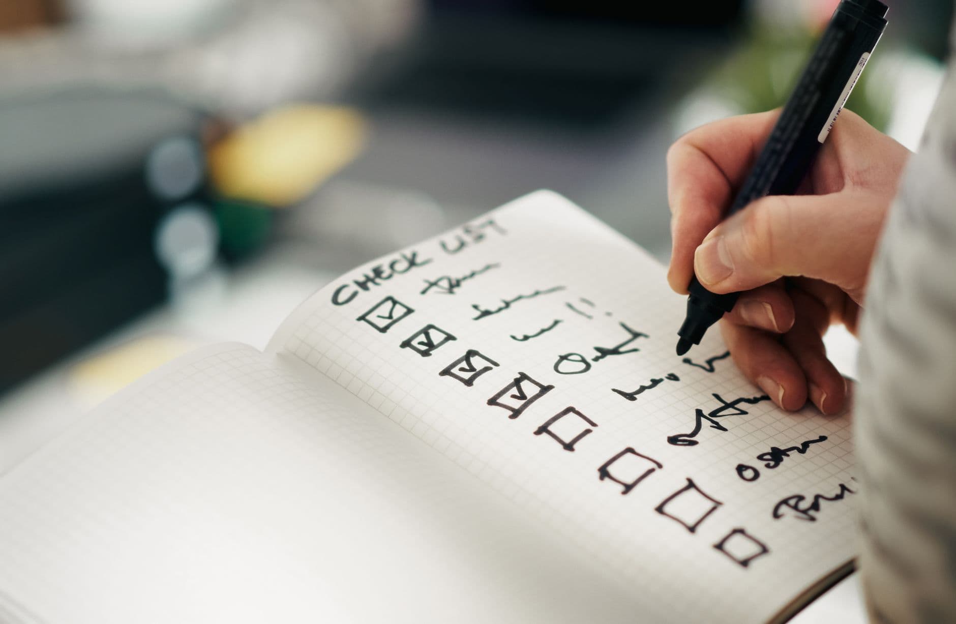 Person reviewing a checklist on a clipboard